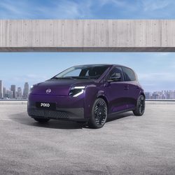 Three-quarter front view of a purple Nissan PIXO electric city car parked beneath a modern concrete structure, with a city skyline in the background.